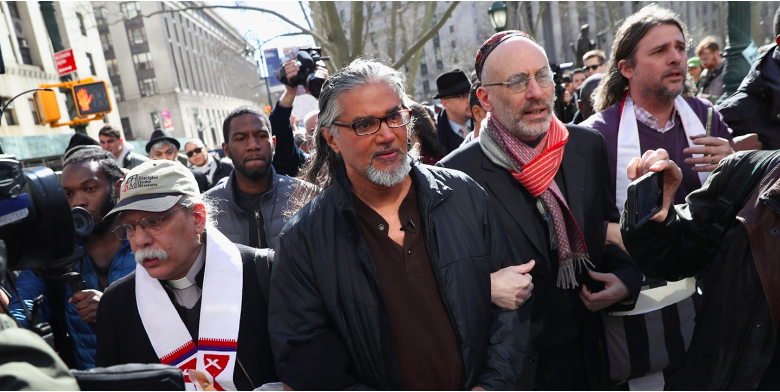 Protesters accompany prominent immigration activist Ravi Ragbir, outside the U.S. Immigration and Customs Enforcement office at the U.S. Federal Building during a Solidarity Rally Against Deportation on March 9, 2017, in New York City.